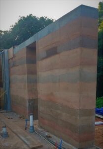 Rammed earth house under construction