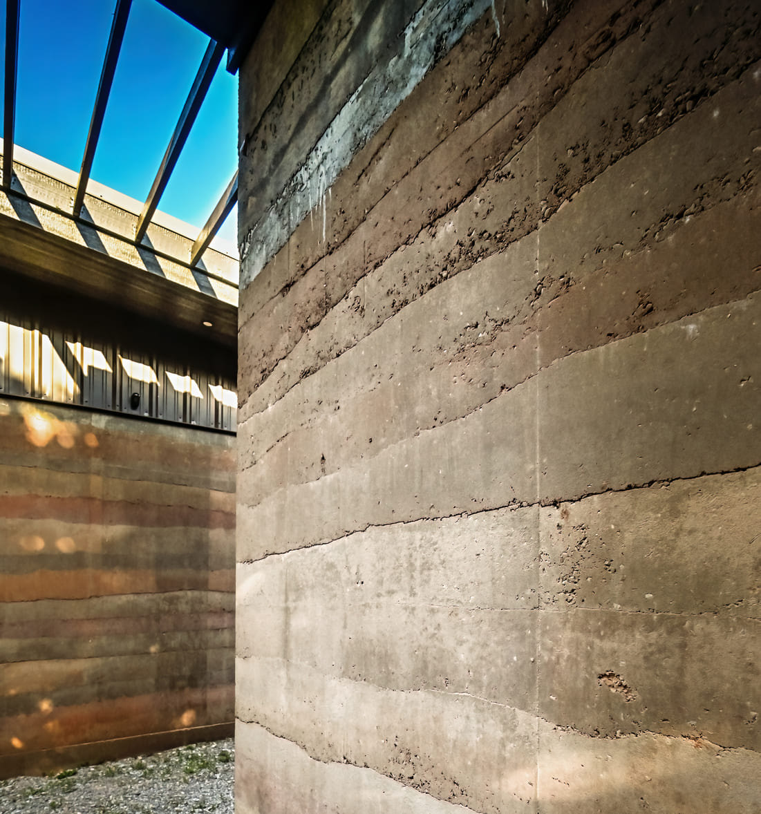 A photo of a rammed earth construction exterior wall.