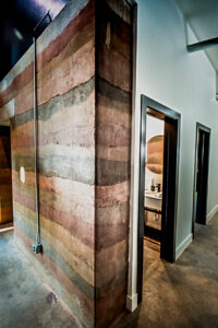 A photo of a rammed earth modern interior wall
