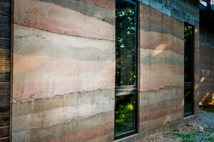 Rammed earth house with windows.